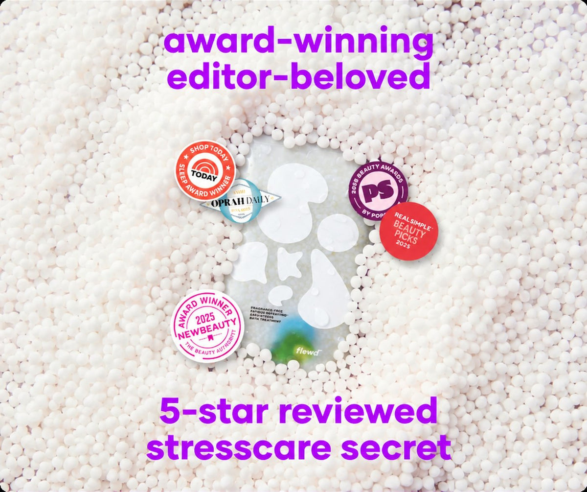 Flewd fragrance-free Fatigue Defeating magnesium bath soak clear pouch splashing into water on a green background