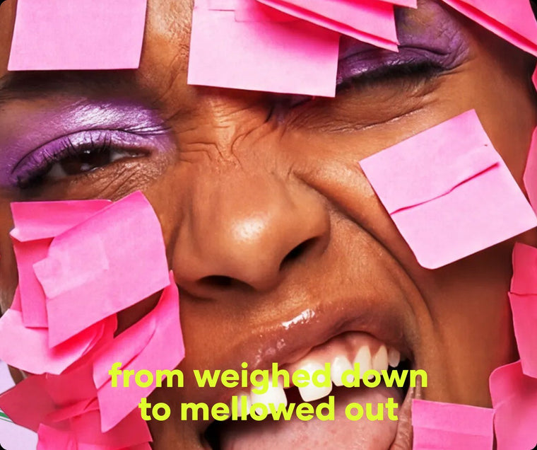 Smiling face half covered in pink sticky notes