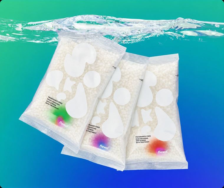 Three fragrance-free Nootropic Trio bath soak pouches underwater