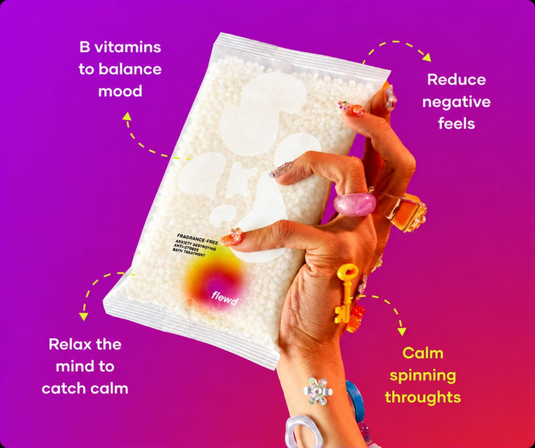 Fragrance-free Anxiety Destroying pouch in a hand with colorful rings, part of the Flewd Whole Mood Bundle