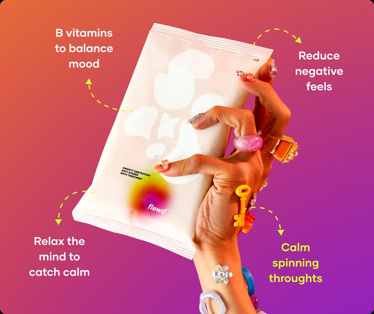 Anxiety Destroying pouch in a hand with colorful rings, part of the Flewd Stresscare Trio